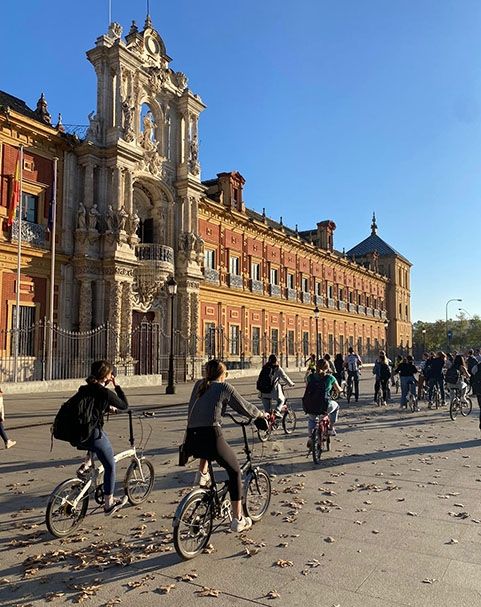 students biking in seville spain on a study abroad program