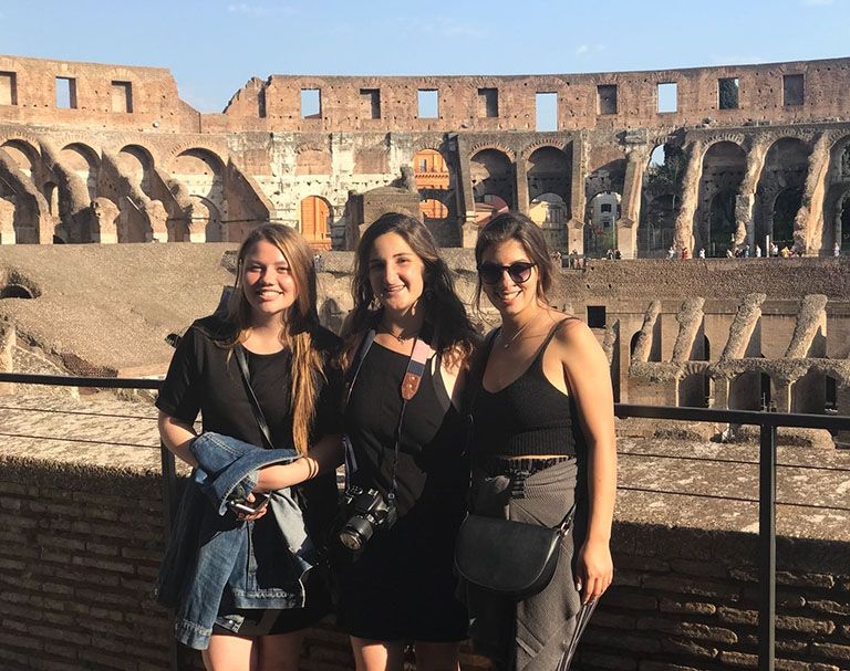 students at the colosseum in italy on an excursion