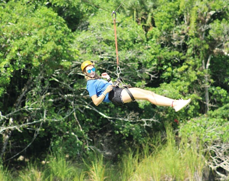 study abroad student ziplining in yucatan mexico