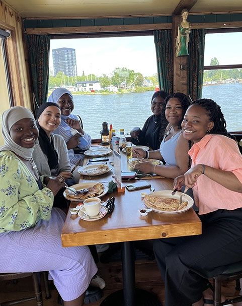 students on a boat tour in amsterdam