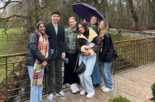 paris study abroad student group on a rainy day