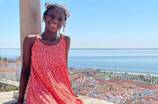 study abroad student in lisbon by ocean overlook