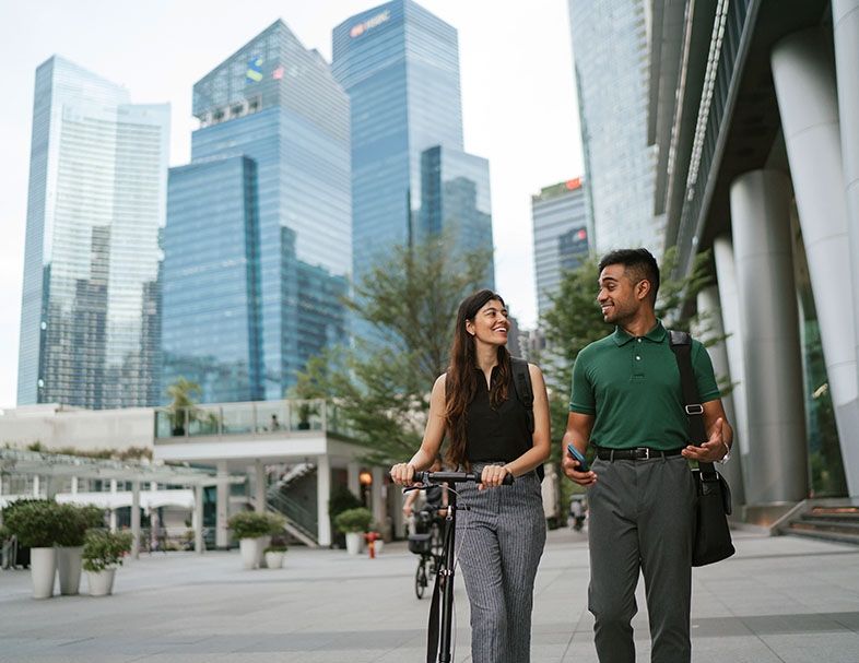 interns in singapore walk with bike