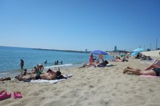 beach tanning spain barcelona