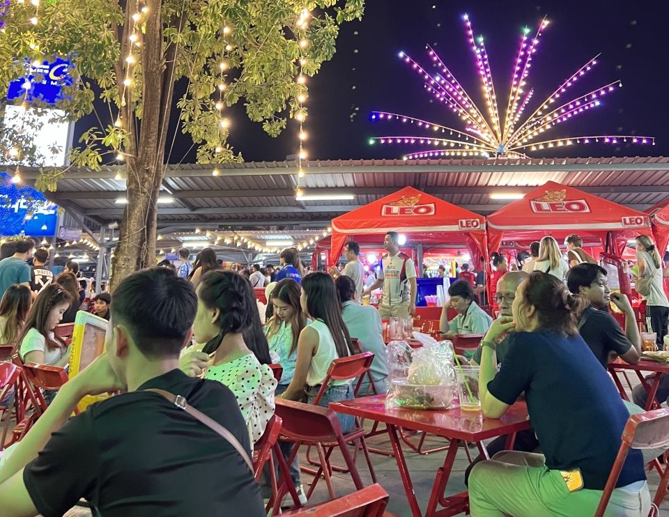 Picture of outdoor festival and neon lights.