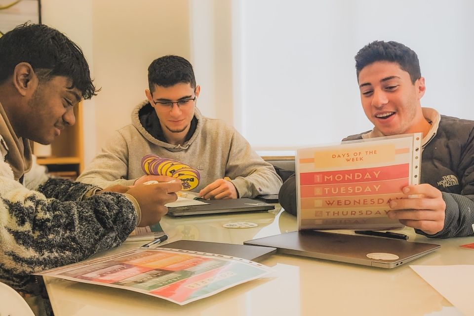 Students sitting at desk working on a group activity