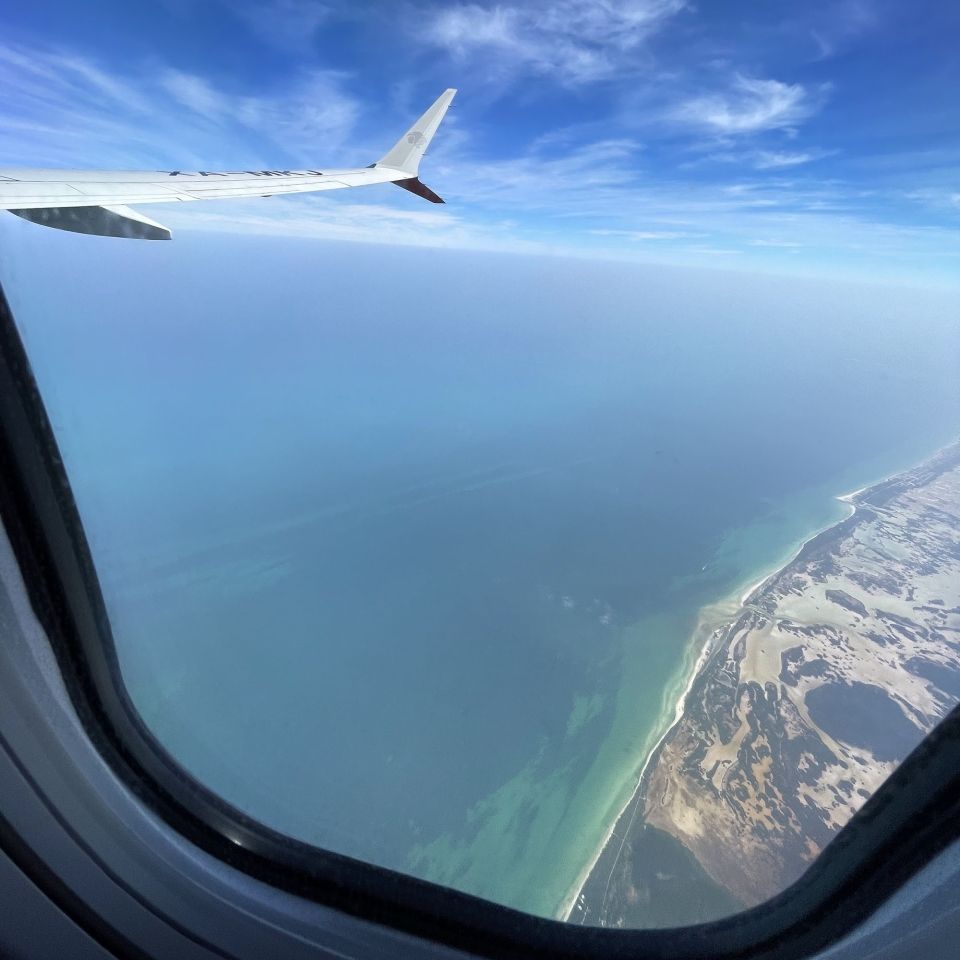 plane window overlooking mexico ocean