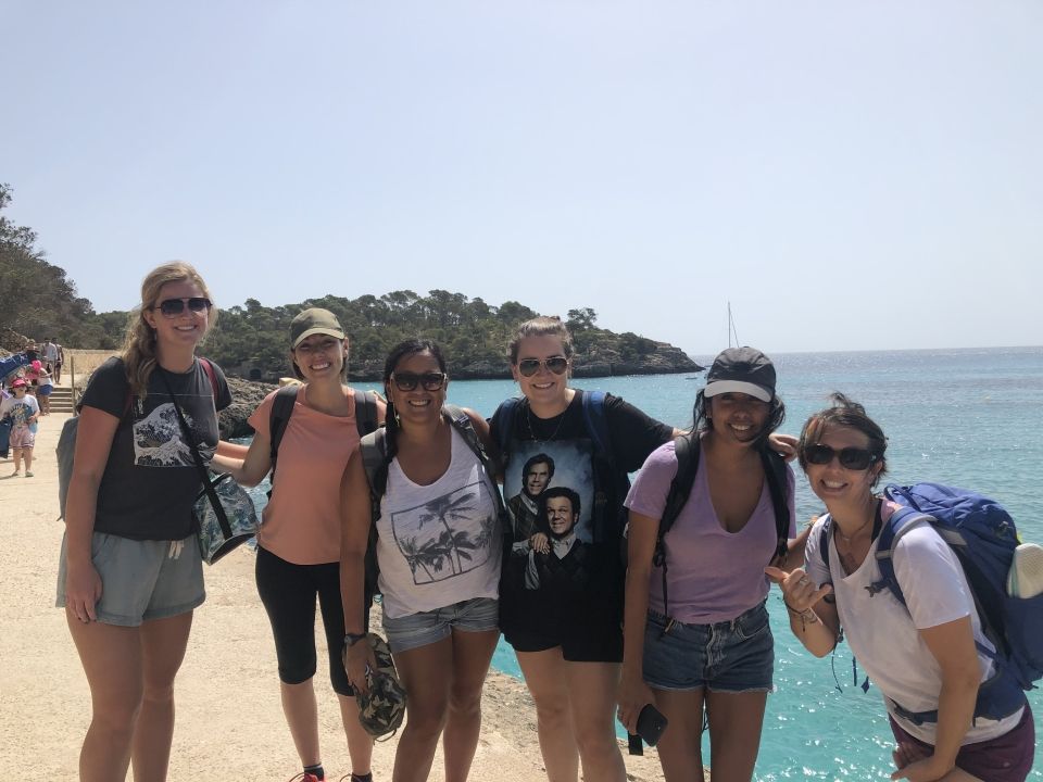 High School Summer Abroad Program Leaders leading students to a field work activity