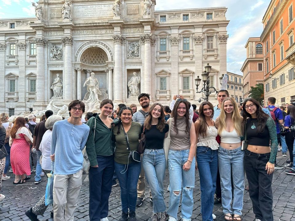 Students posing on the street in Trevi District