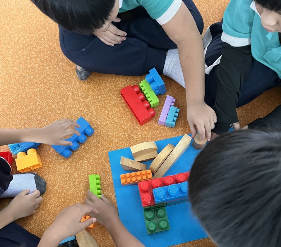 bird's eye view of kids playing with blocks
