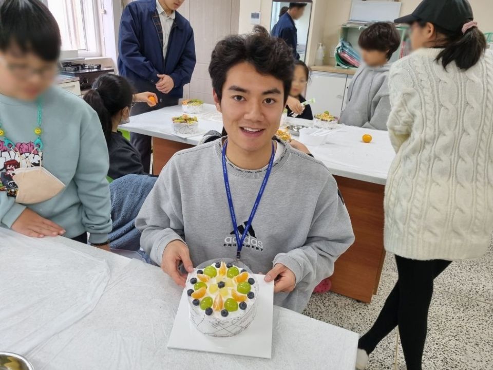 Me with a cake I made at school
