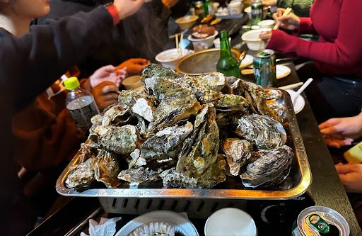 Having an oyster dinner with locals