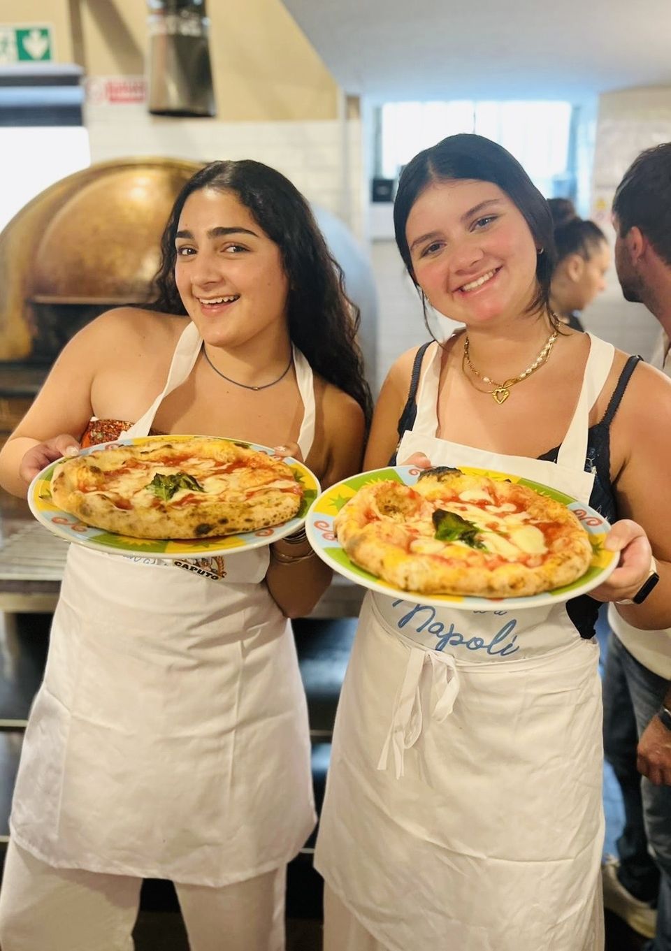 Elena and Ruhi with their finished pizzas!