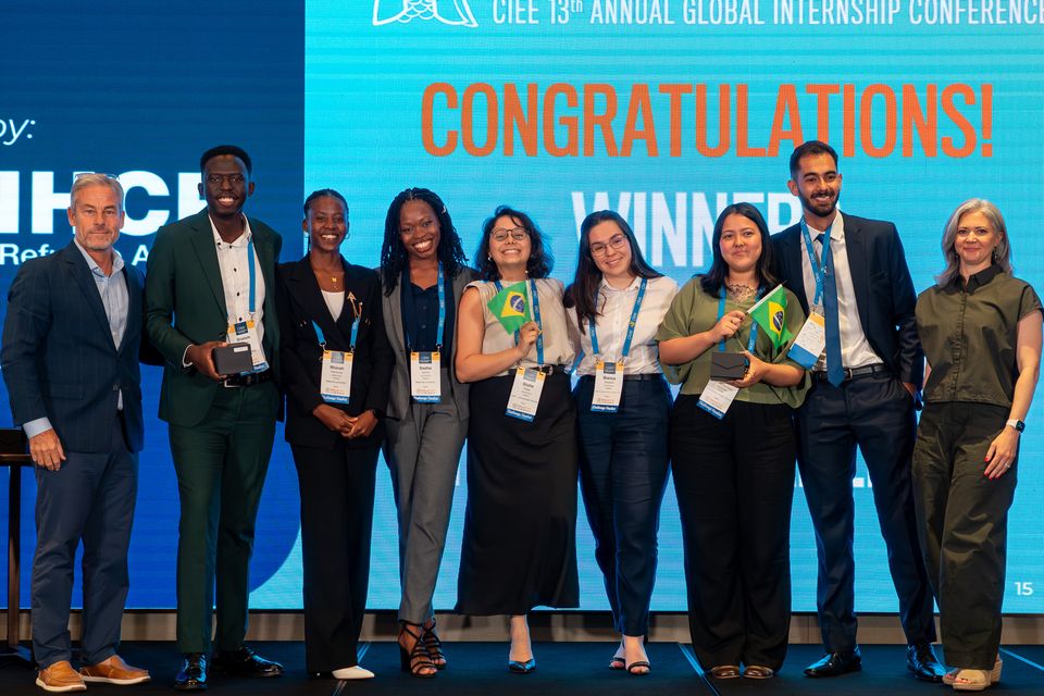 the student challenge winners on stage with CIEE CEO and President Jim Pellow