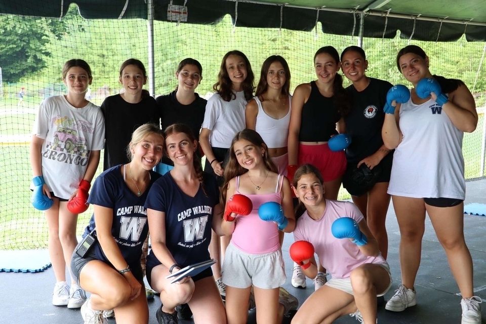 Brooke F. and others at Camp Walden take a group photo after a boxing activity.