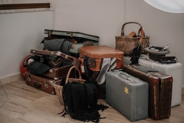 Photo of a bunch of luggage stacked on top of each other