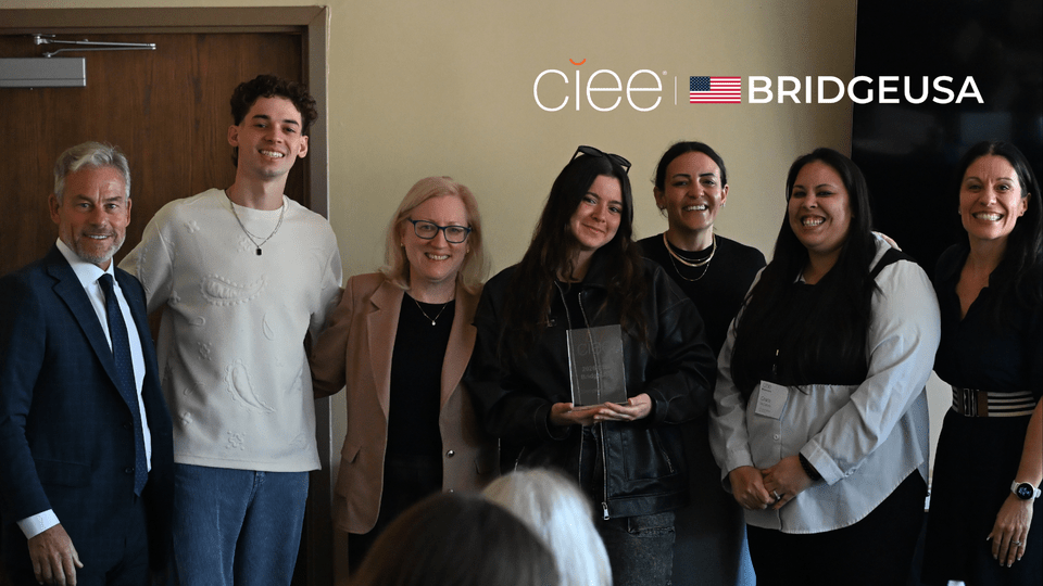 Grace McCollum, Manager of Hospitality Food and Beverage at Vail Resorts, receives the 2026 CIEE BridgeUSA Champion Award during a recognition event in Park City, Utah.