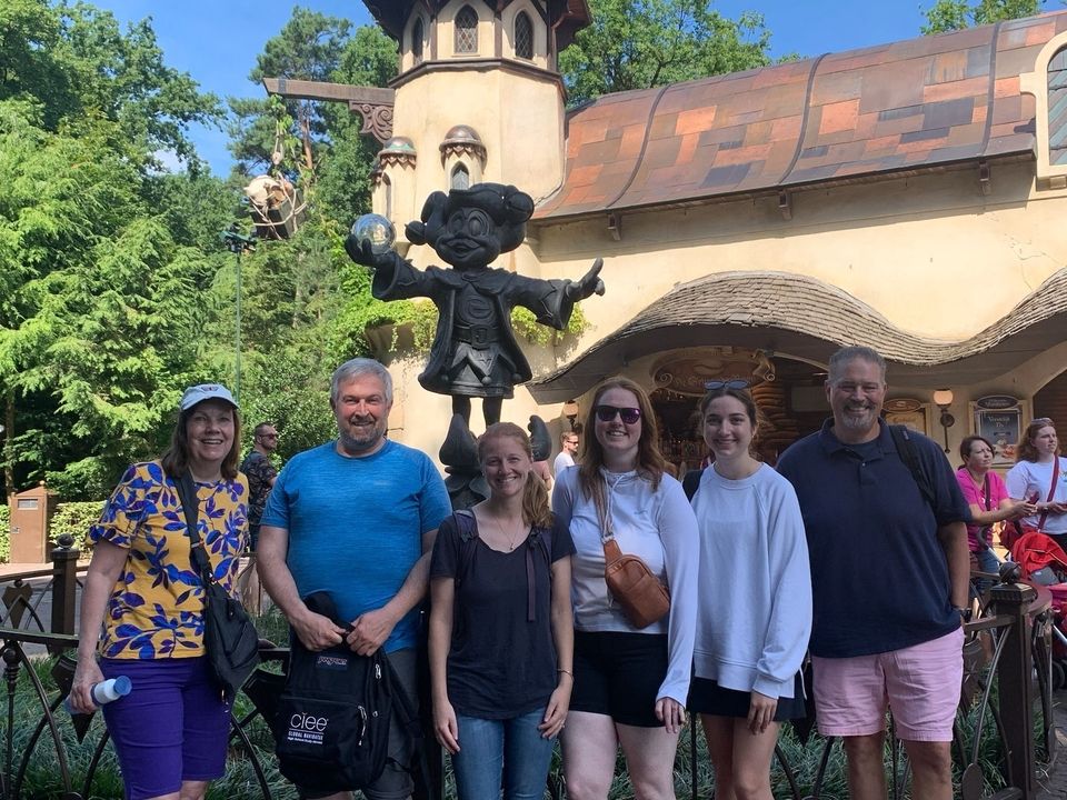 Program leaders posing in front of statue in Amsterdam