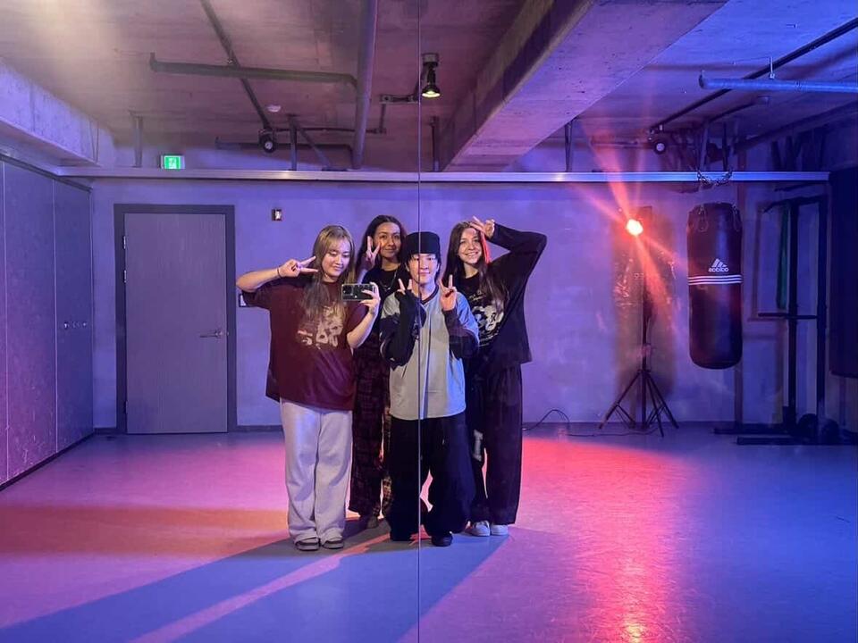 4 people taking a mirror selfie
