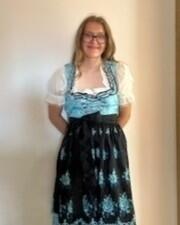 Hannah poses before the Volksfest, dressed in her dirndl.