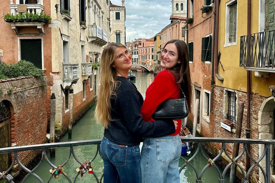 CIEE Florence students on a bridge overlooking a canal in Venice during day trip