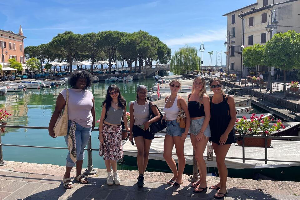 Students posing on bridge in Italy