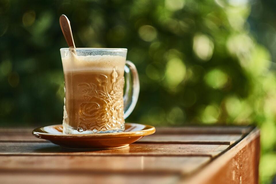 Frothy tea in sunlight