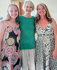 Linda Orr with a deNoyelles Navigator Scholarship recipient and her mother.