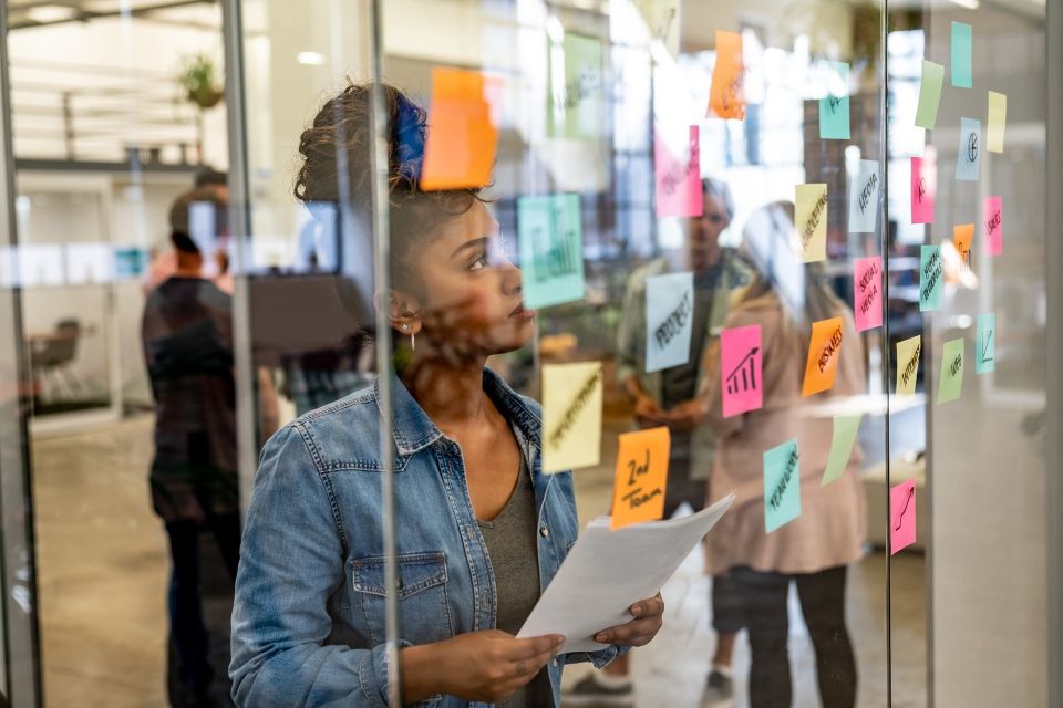 Intern reading postits