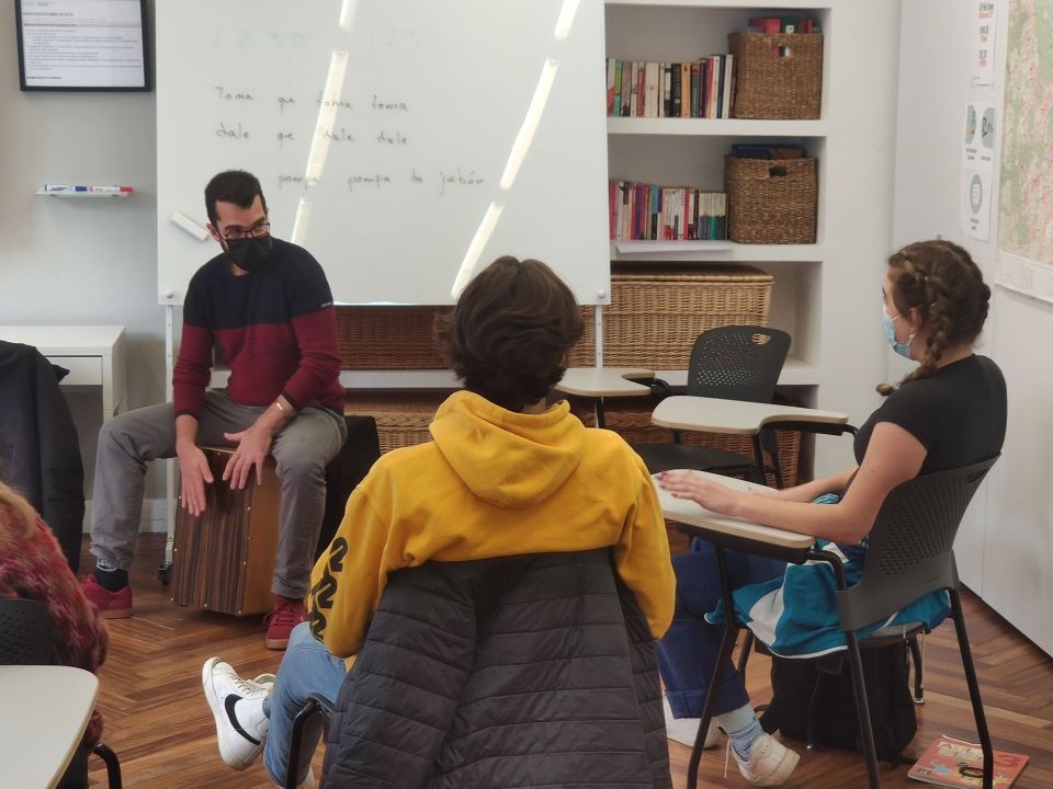 Teacher and students in classroom learning