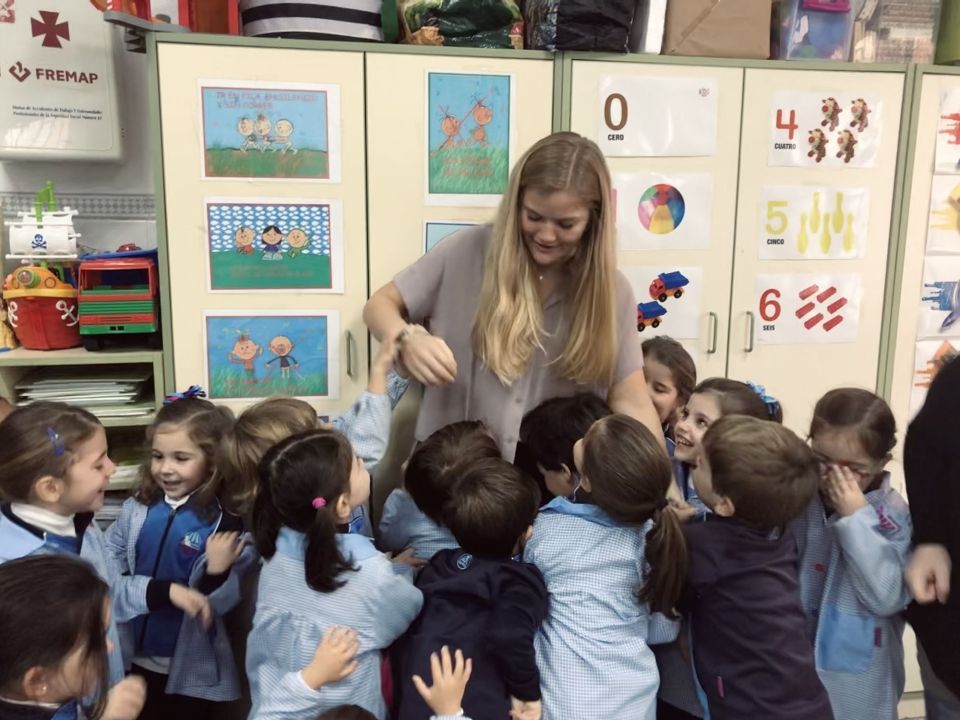 Teaching assistant with her young students in Spain