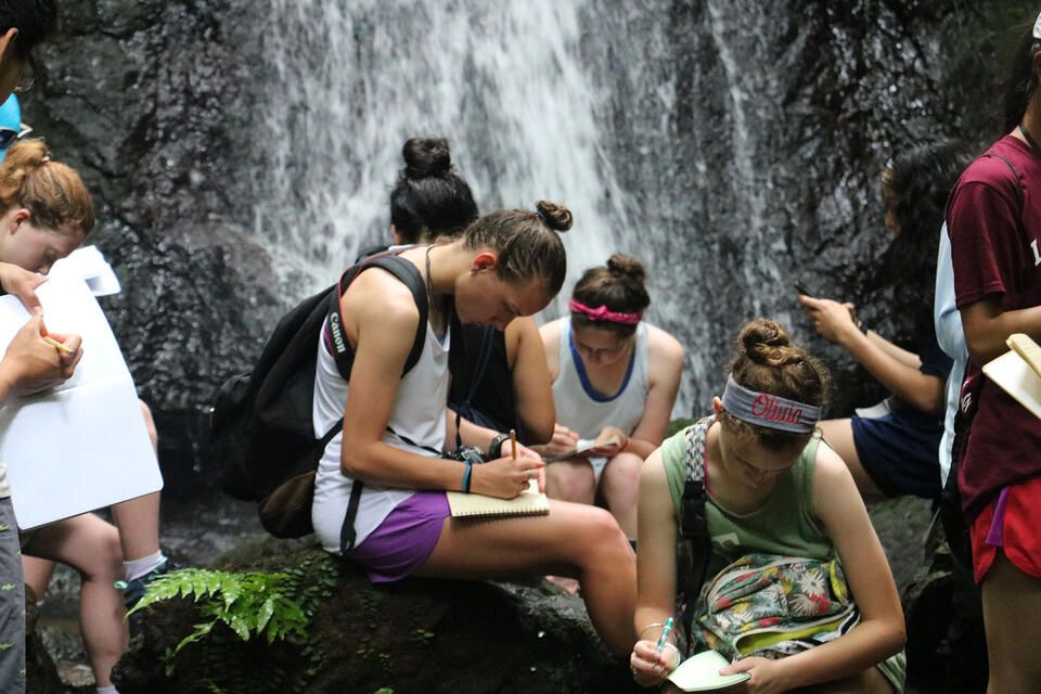 monteverde_students-sitting-in-the-nature-listening.jpg