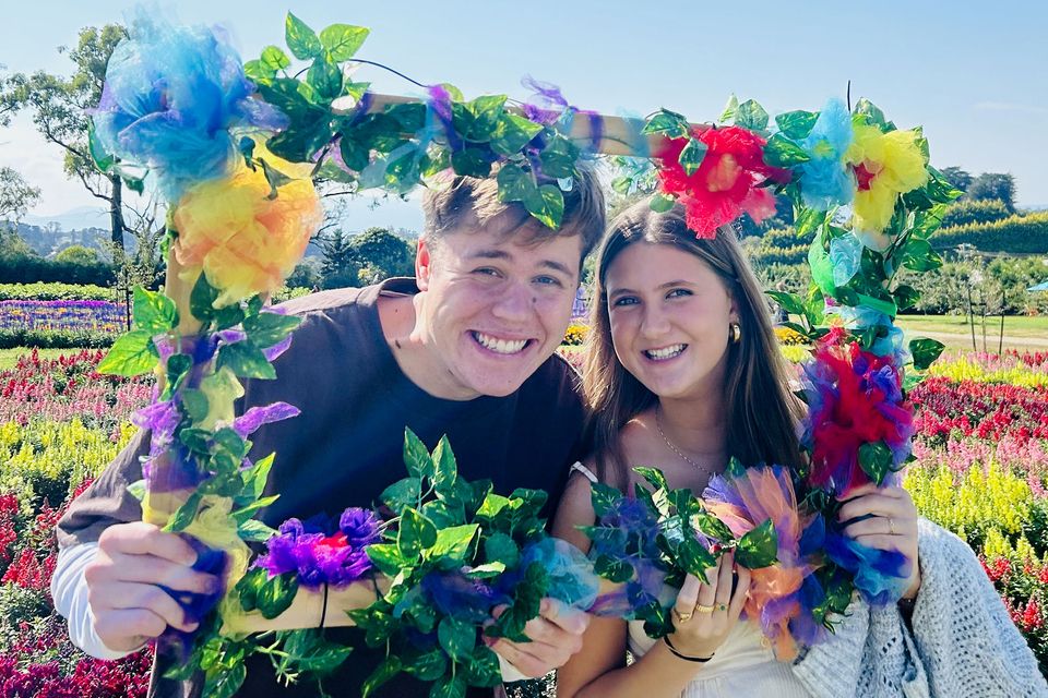 melbourne-two-students-posing-flower-frame-flower-festival.jpg