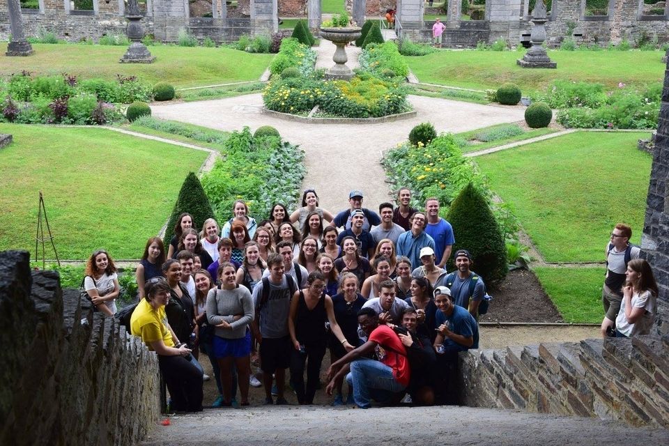 students pose in garden space in Brussels, Belgium