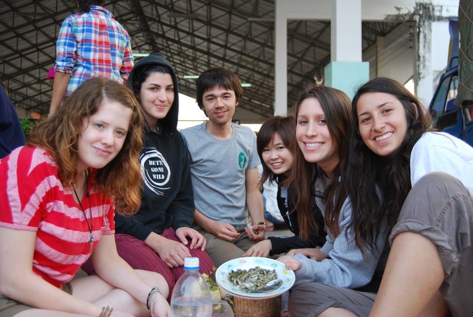 Group of study abroad participants enjoying local food at Thailand market