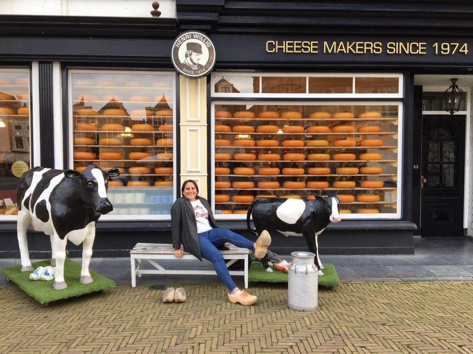 CIEE Brussels student poses in front of cheese shop