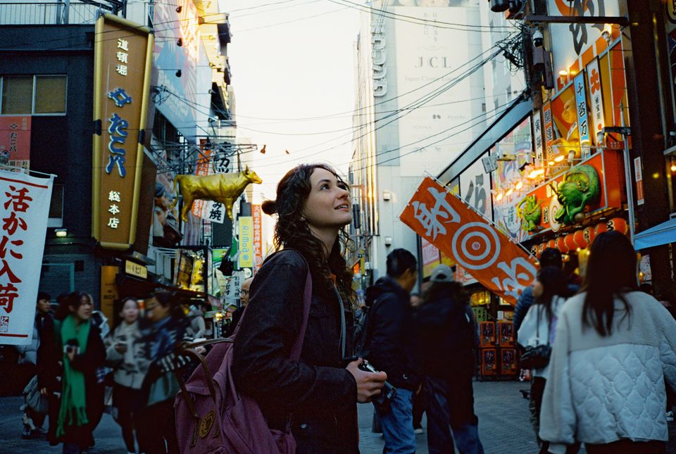 Woman exploring Osaka city during Japan trip