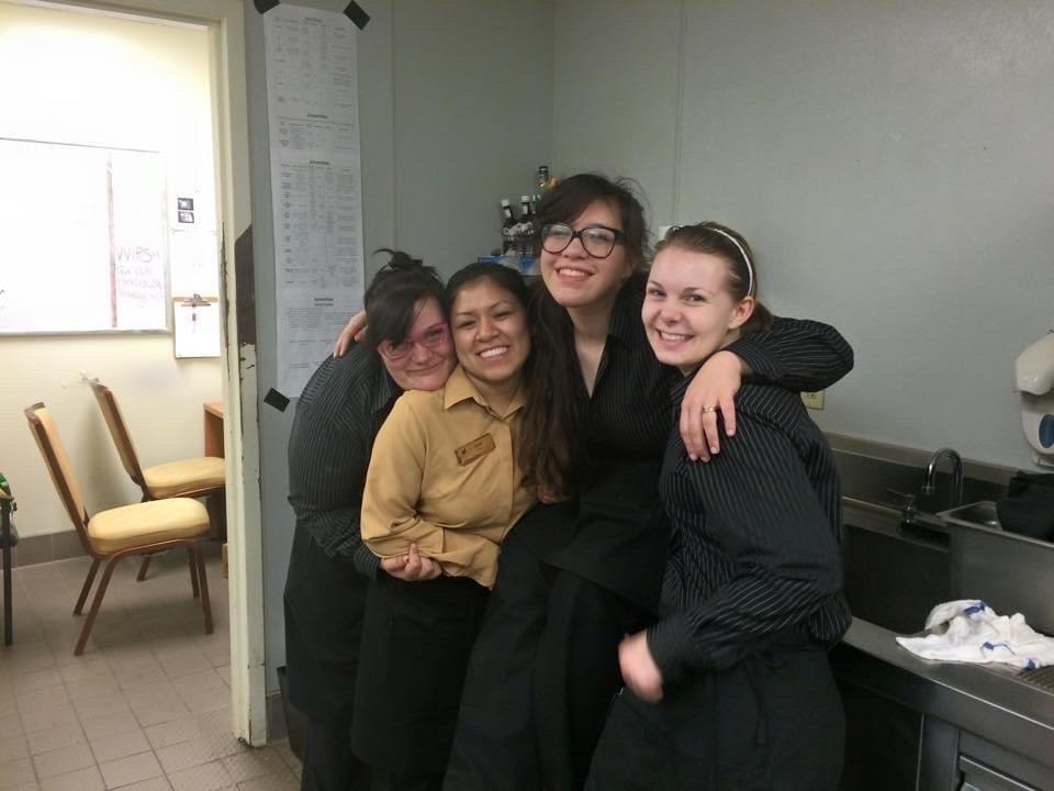 Second from right, Jolicoeur posts with more friends from work.