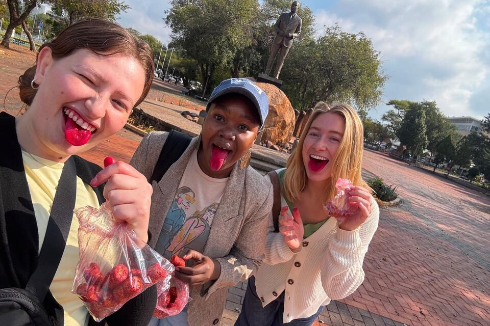 Students eating chips bought from a tuckshop
