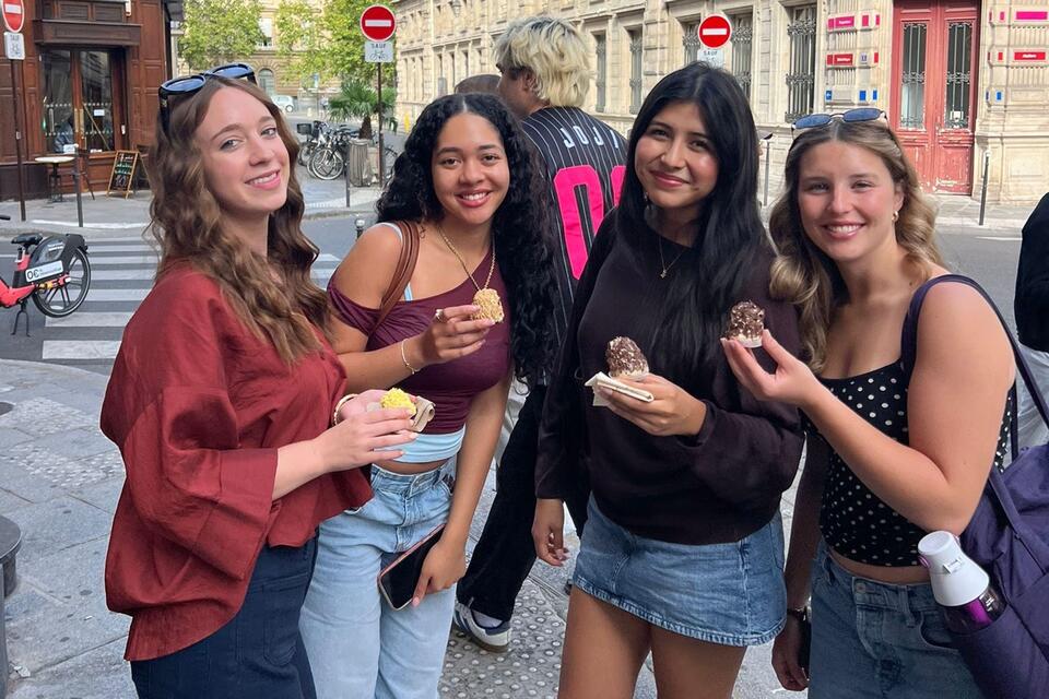 A group of Fall Study Abroad students having a picnic at Place des Vodges