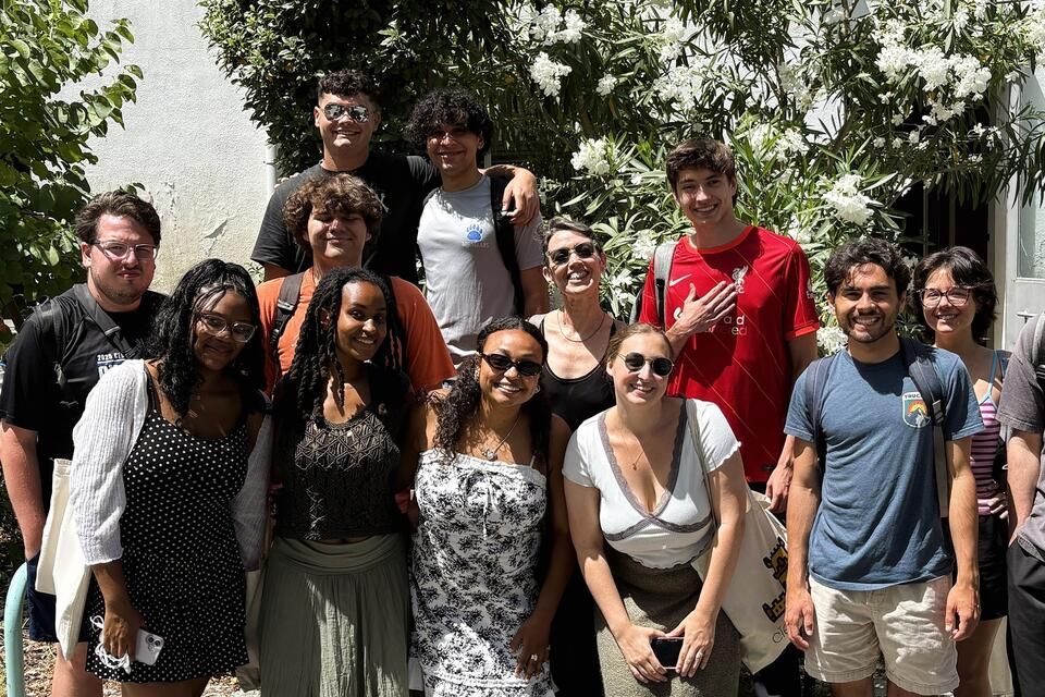 CIEE Lisbon students posing with their course instructor