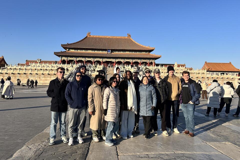 J Term students in Shanghai pose for picture in front of temple