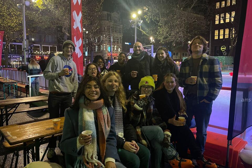 CIEE College Study Abroad students enjoy drinks and ice skating at Christmas market in Amsterdam