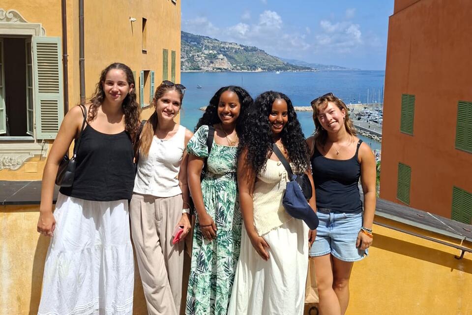 CIEE Nice female students pose at oceanside outlook in Nice