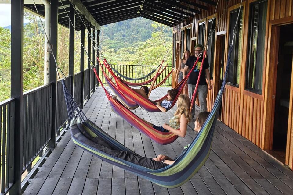 CIEE Monteverde students lounging in hammocks on campus